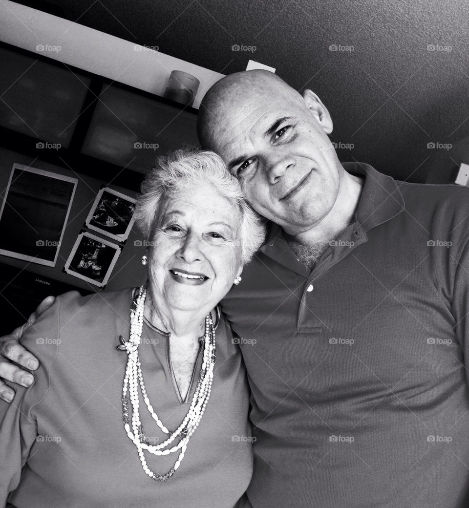 MOTHER AND SON IN THE HOUSE, SMILING, PORTRAIT