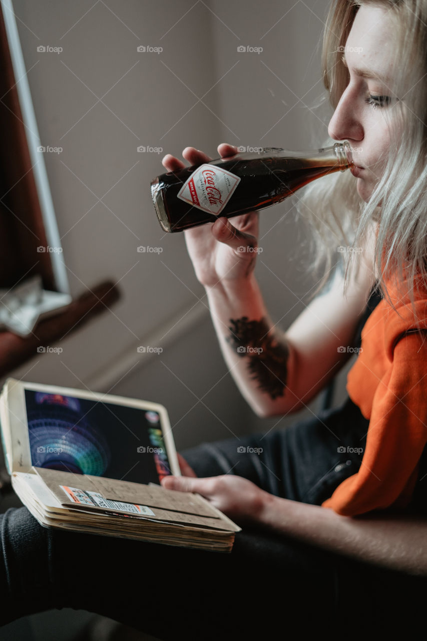 blond girl chilling with coca cola