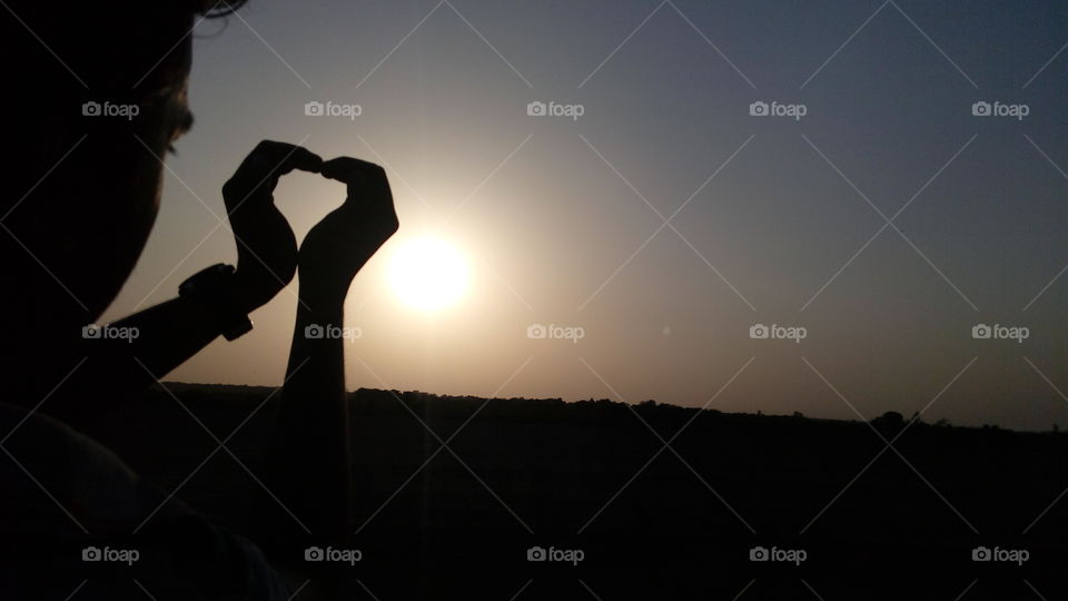 men hands shape and shades pattern shadows at  sunset