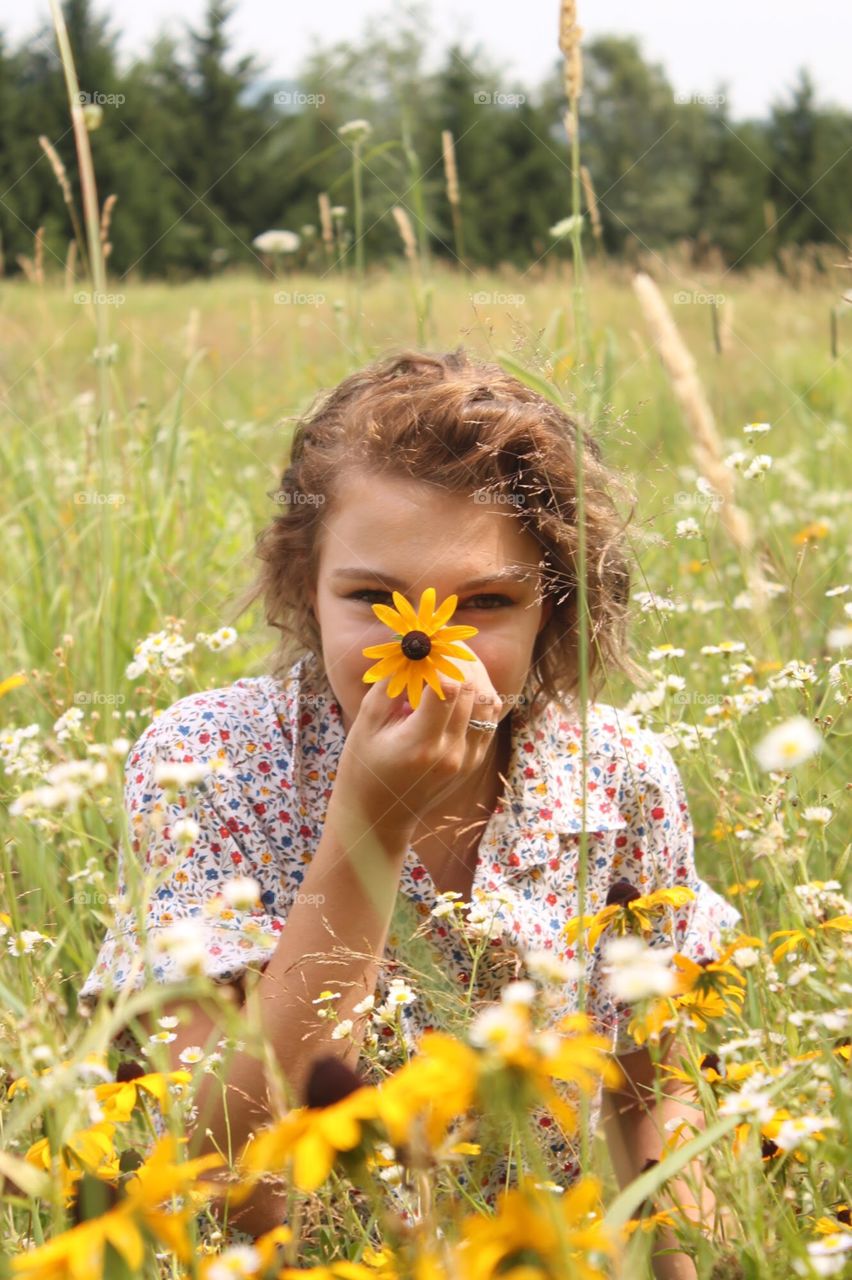 Girl with a wild daisy