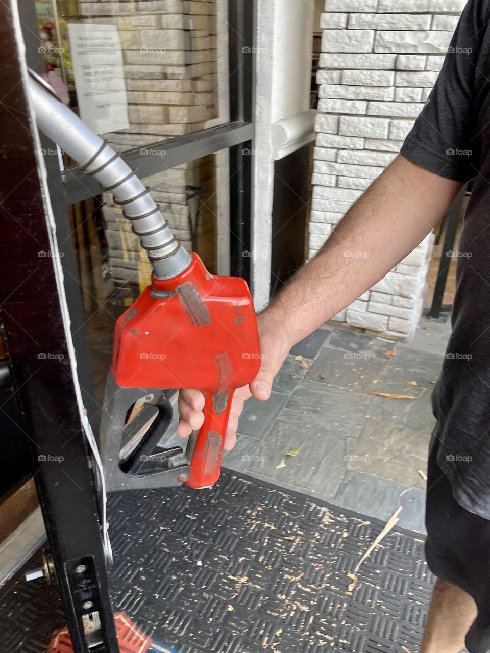 Gasoline nozzle door handle 