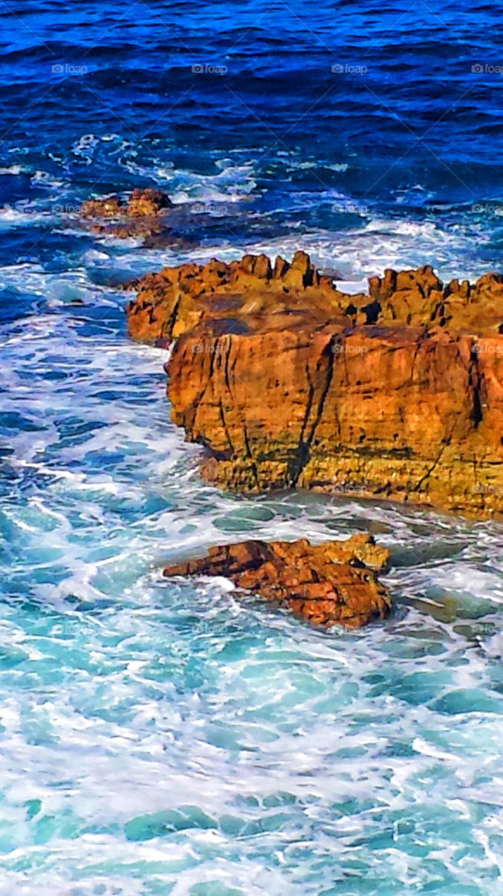 High Tide @ Red Rock Cliff. High tide at rock cliff in Hiesler Park in Laguna Beach