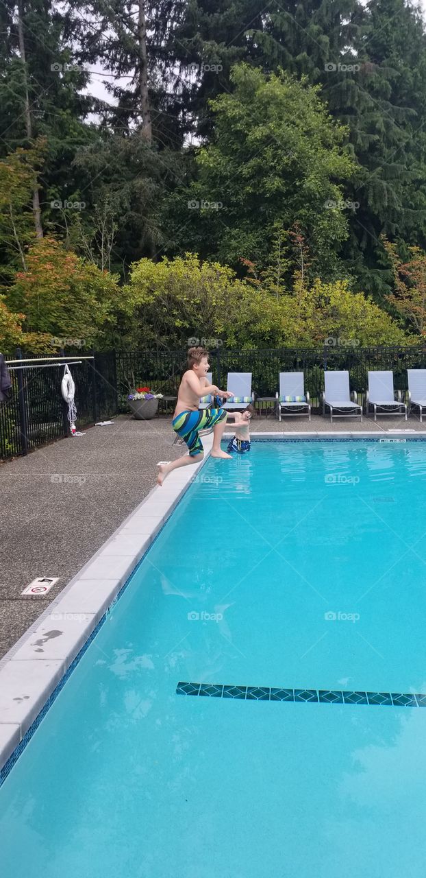 boys playing in pool