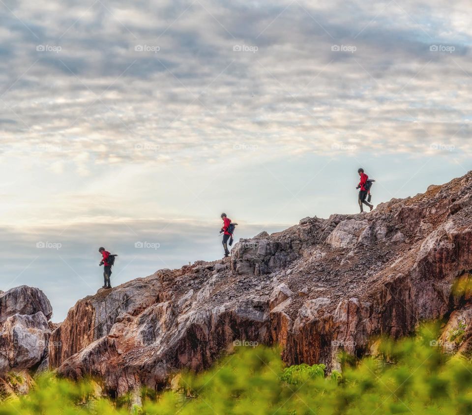 Panorama scene of camera man walk on rock mountain