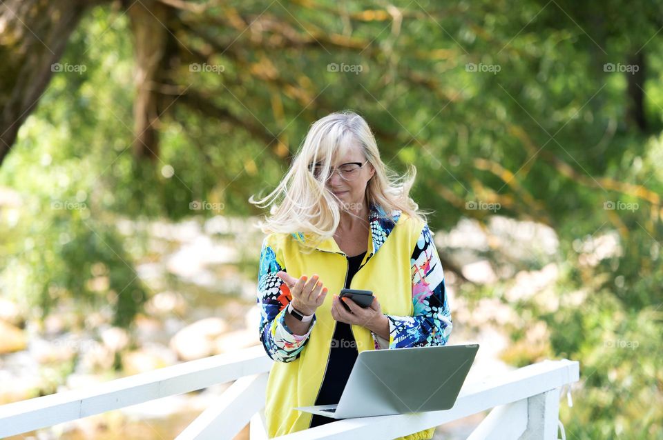 Excited woman talking on the phone