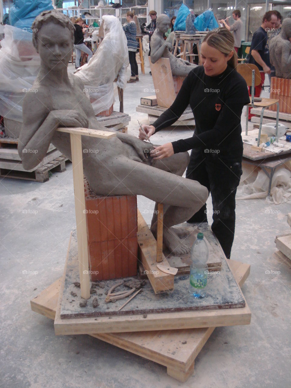 Woman making statue