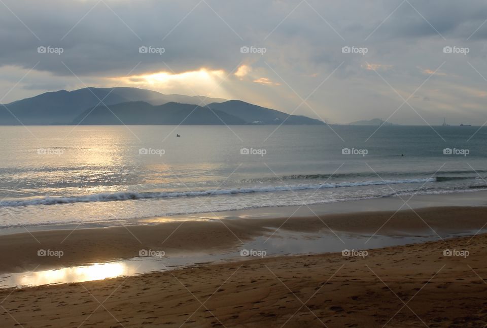 Sunrise morning in cloudy of rainy season photo in morning low and dark lighting from big cloud in the gray sky soft and blur.