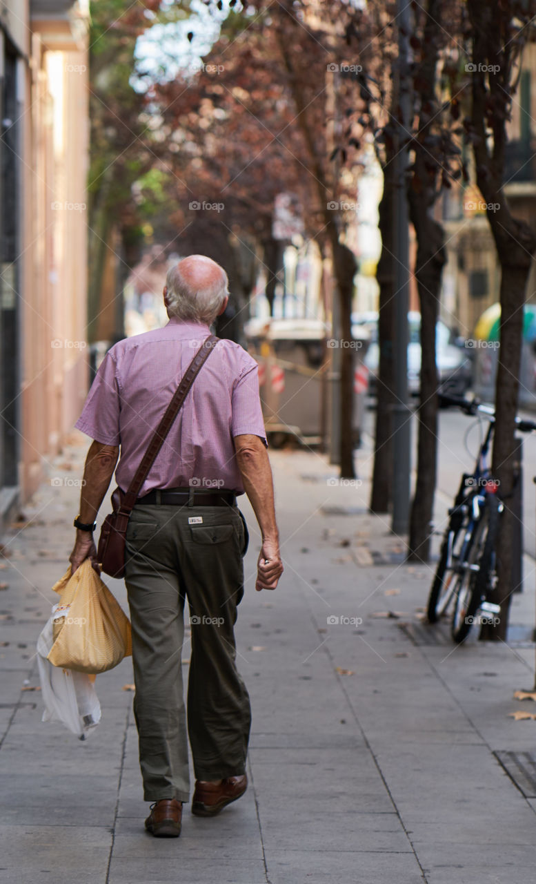 Elderly man going shopping