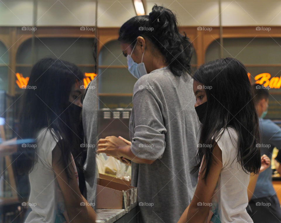 While waiting for mommy shopping.