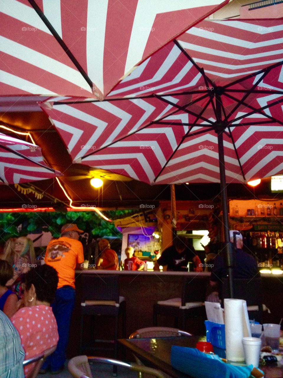☂☂Umbrella covered outside bar & grill at resort hotel ocean side.
