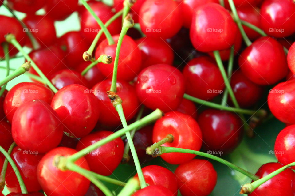 a lot of cherries in plate