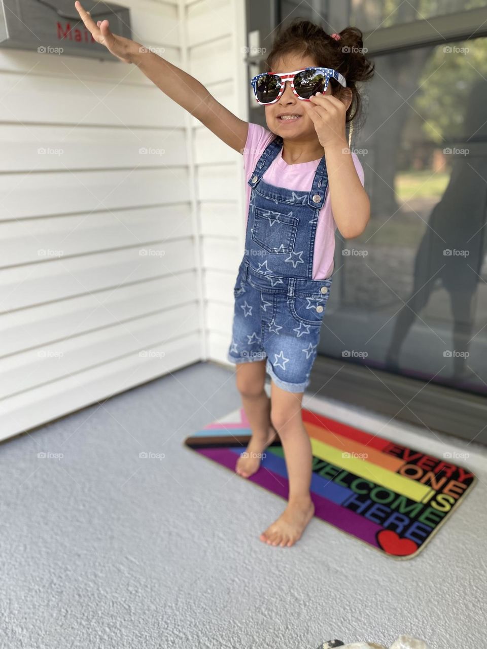 Ready for the fireworks, toddler girl wears flag sunglasses, ready for Fourth of July fireworks, toddler excited for fireworks 