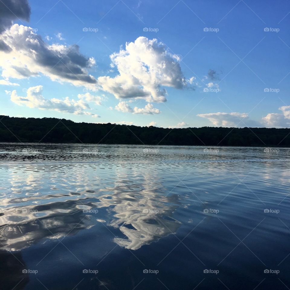 Boat wake ripple effect on lake