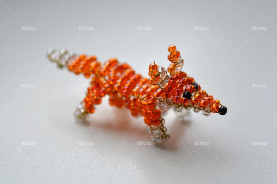 animal fox 🦊 figured from beads on a white background, art and craft hobbies