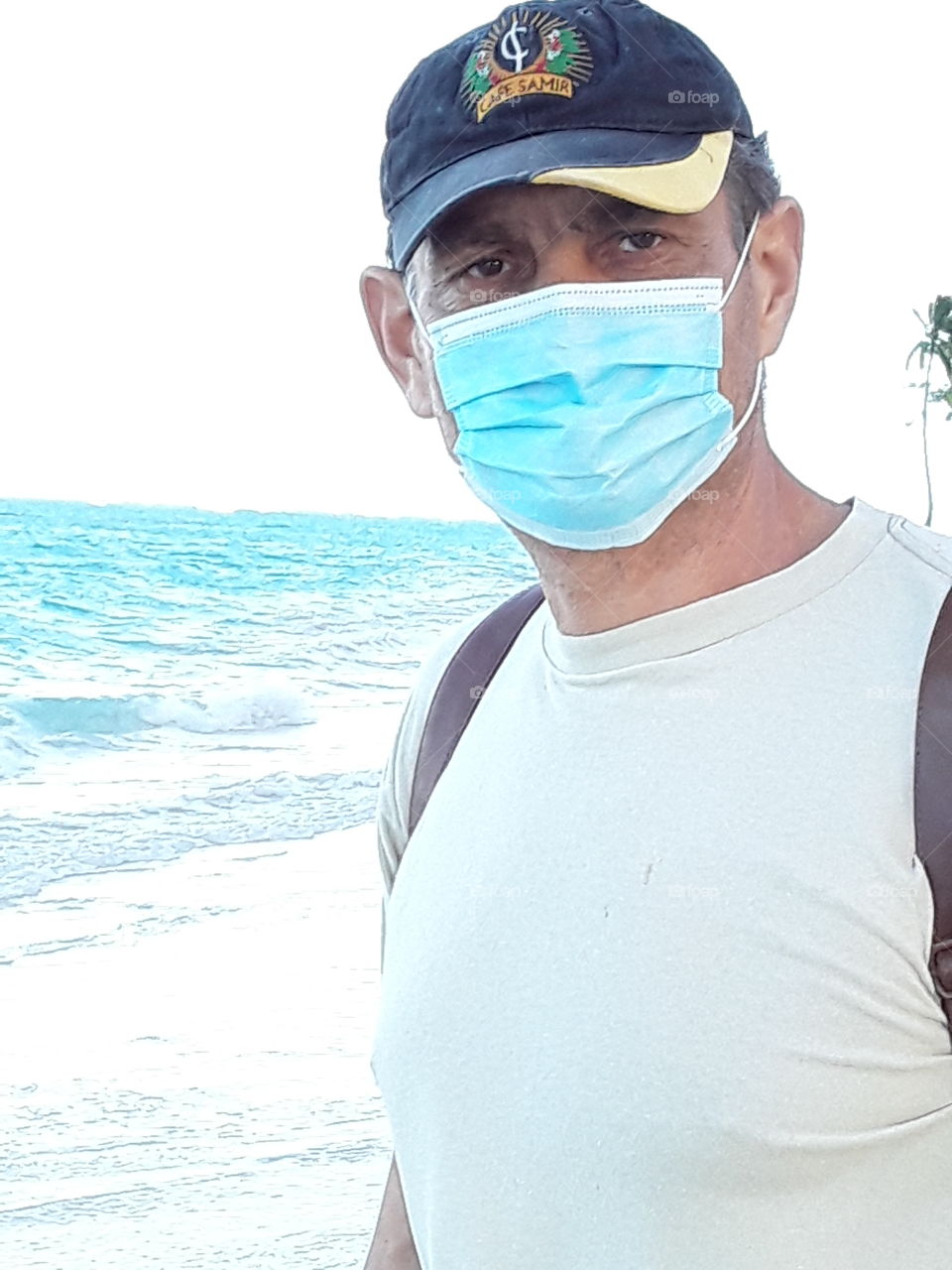 masked man by the ocean