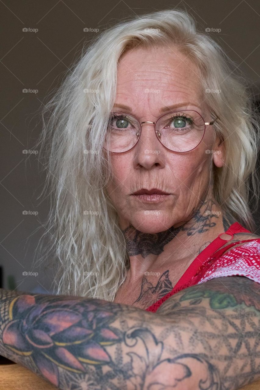 middle aged woman with tattoos