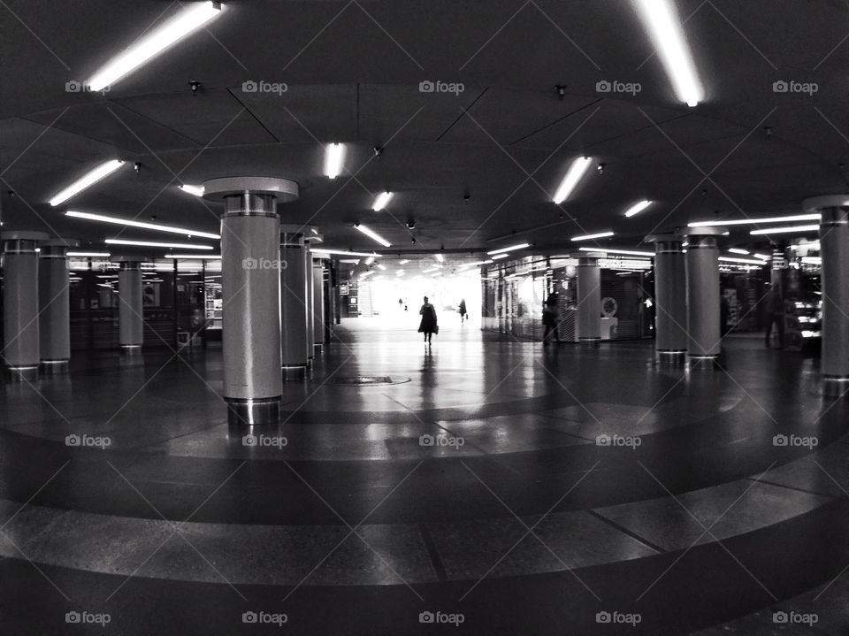 Black and white photo, people in underground 