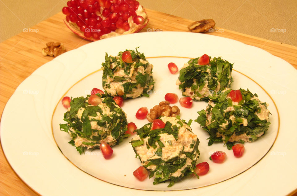 Salad mini bolls with chicken, greenery and walnuts