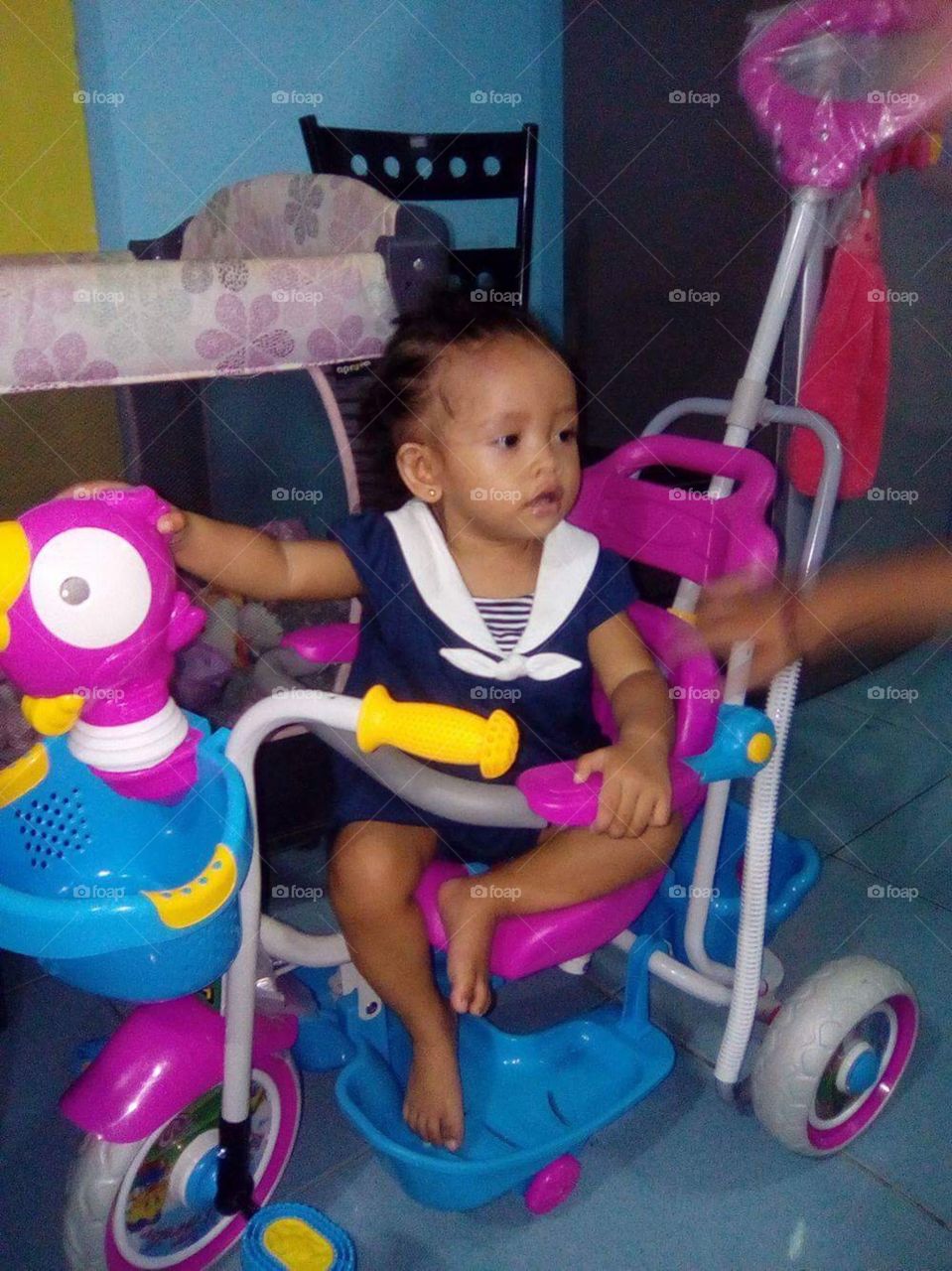Our gorgeous little one year old, enjoying her birthday, with her highlight her very own bike.