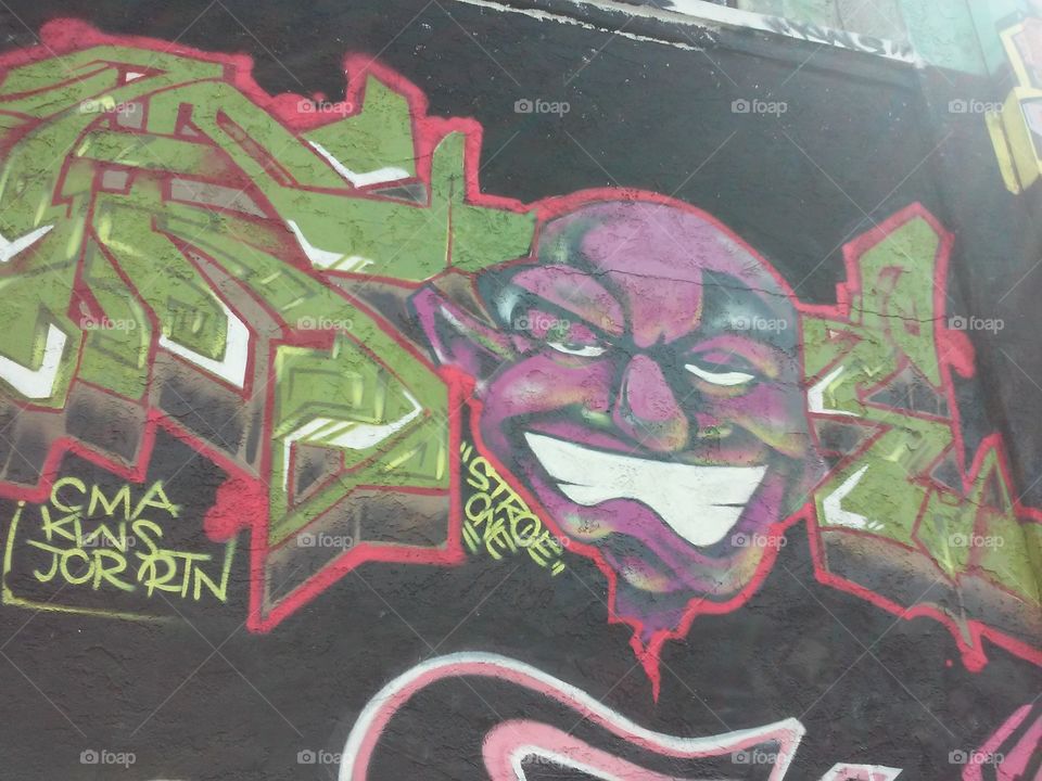 purple face. graffiti 60th and Broadway