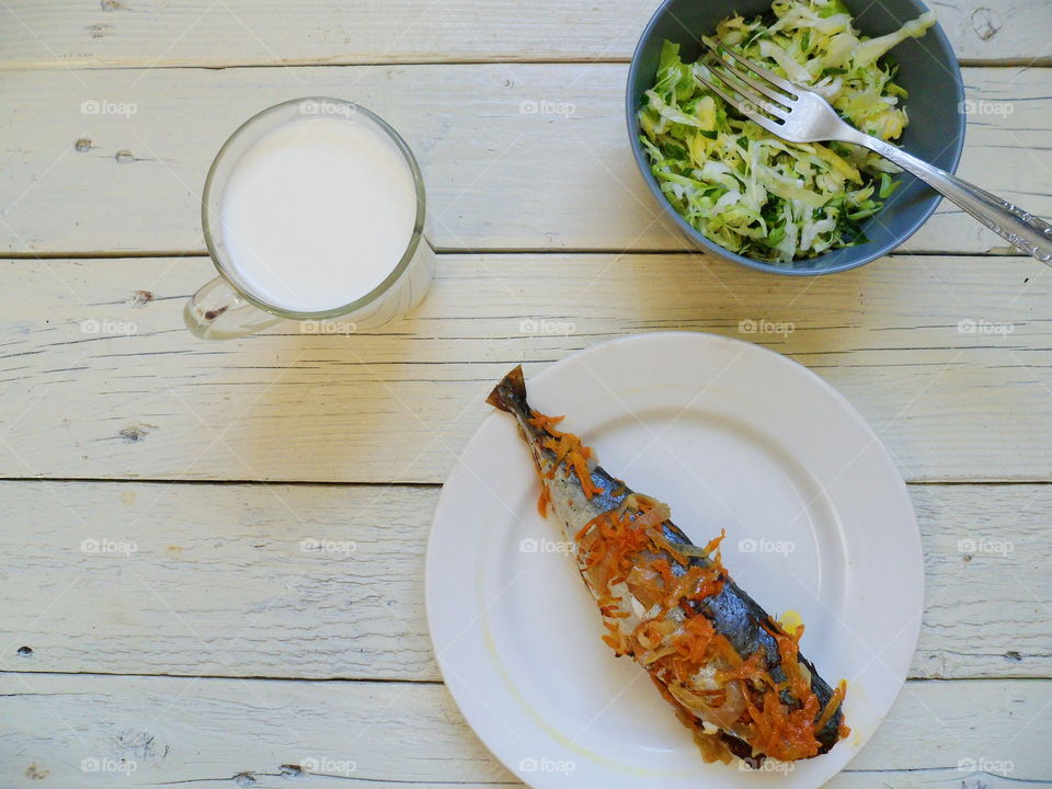 baked mackerel, vegetable salad and a cup of milk, breakfast