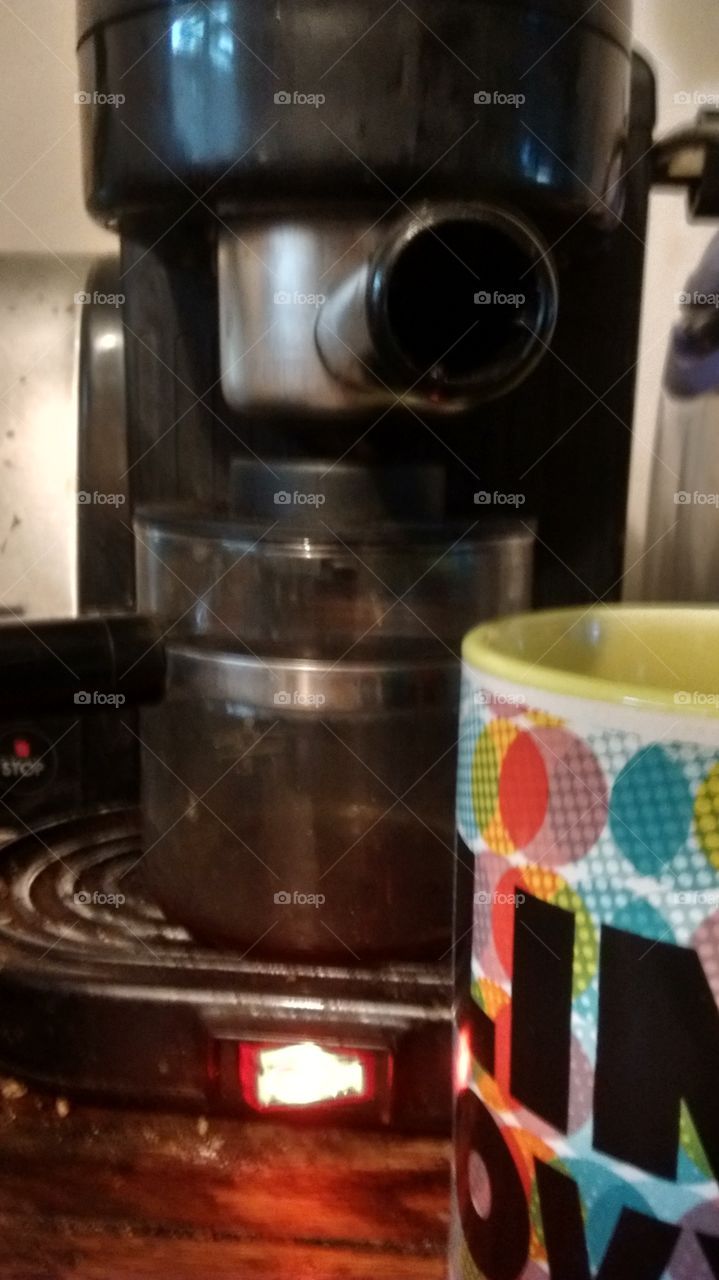 Starting my cup of coffee in the machine