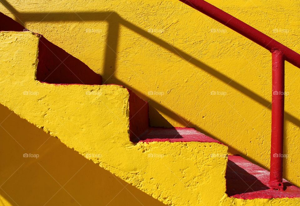 Close up of yellow wall with steps