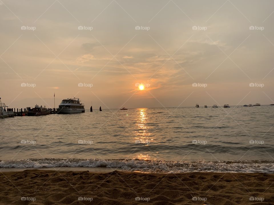 Sunset reflecting off of Lake Tahoe. Foggy evening. 