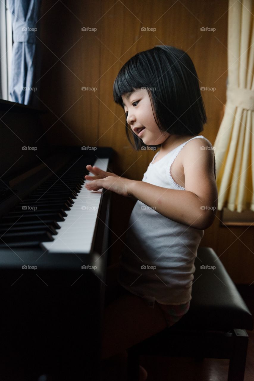 girl playing the piano