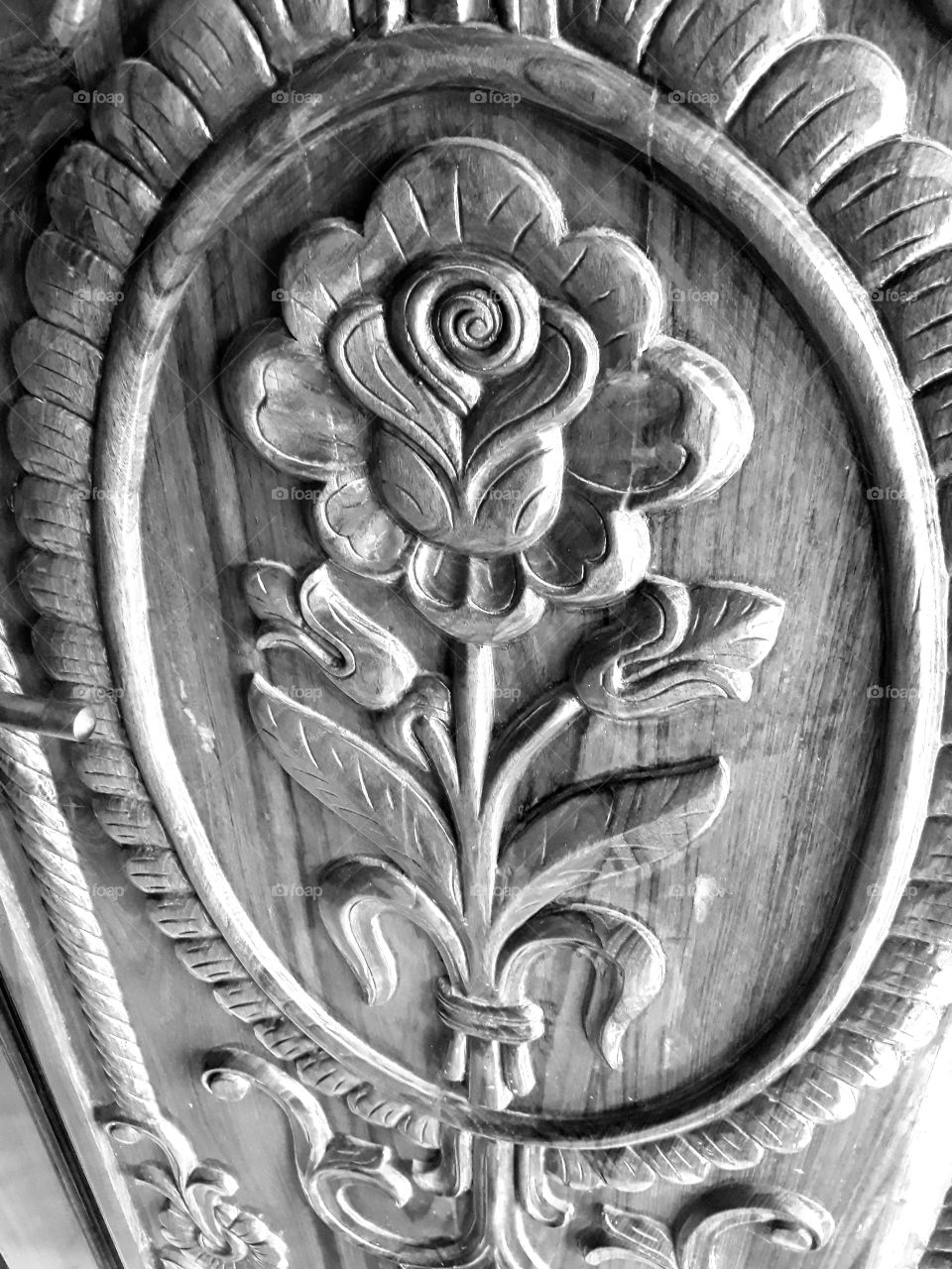 Rose flower design on a wooden entrance door