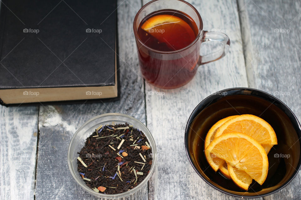 Tea tradition, tea, cup, mug, hot drink, cinnamon, cookies, napkin, jeans, denim napkin, fruit tea, flower tea, citrus, orange, lemon, rose petals, cookies, chocolate cookies, vanilla, vanilla sticks