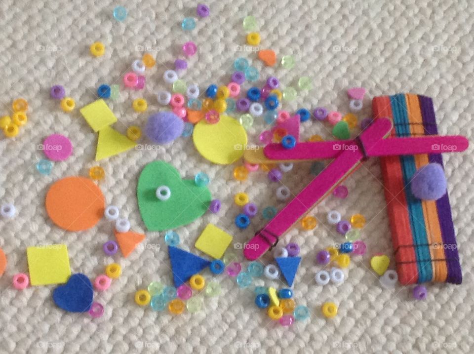 Colorful beads, popcicle sticks and different shape stickers for arts and crafts supplies. 