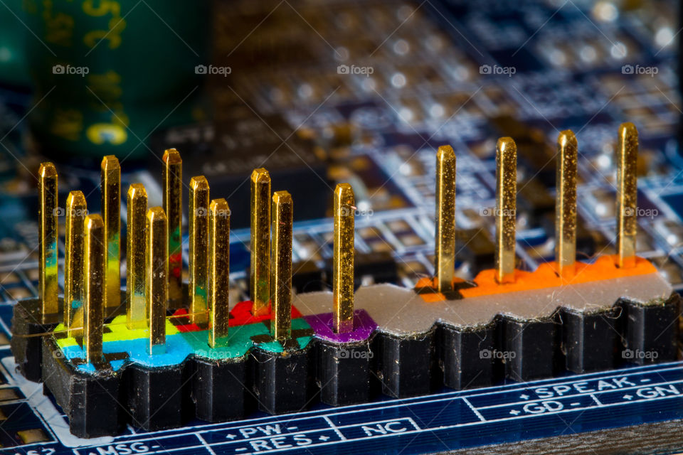 Macro image of computer motherboard with metal pieces