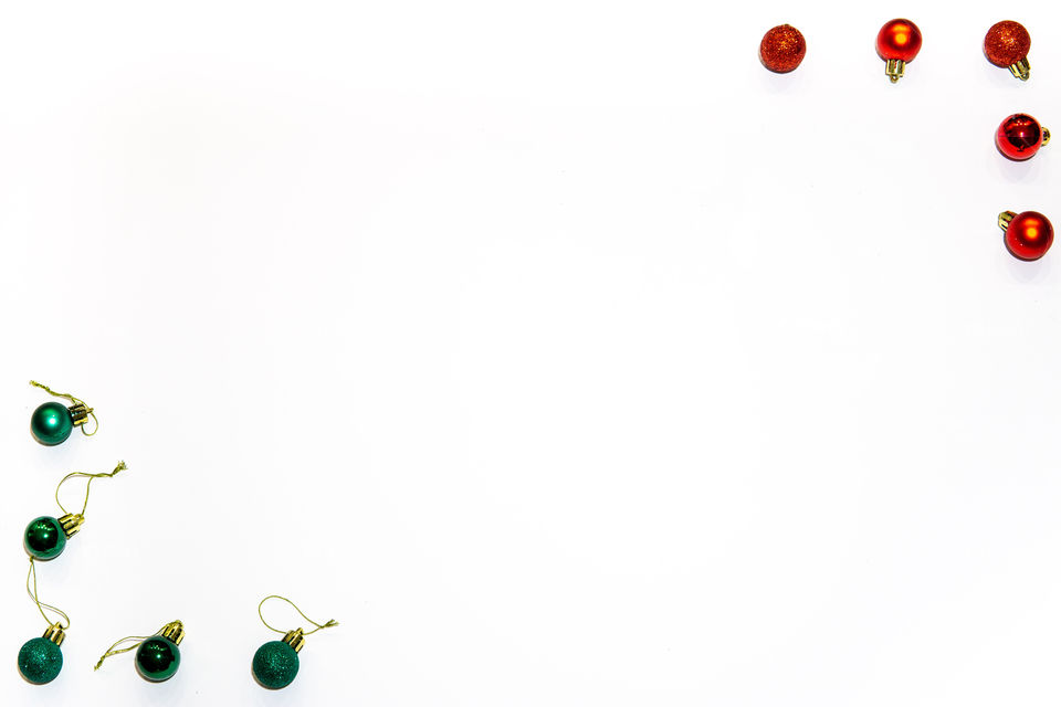 Christmas frame with red and green decorations in corners