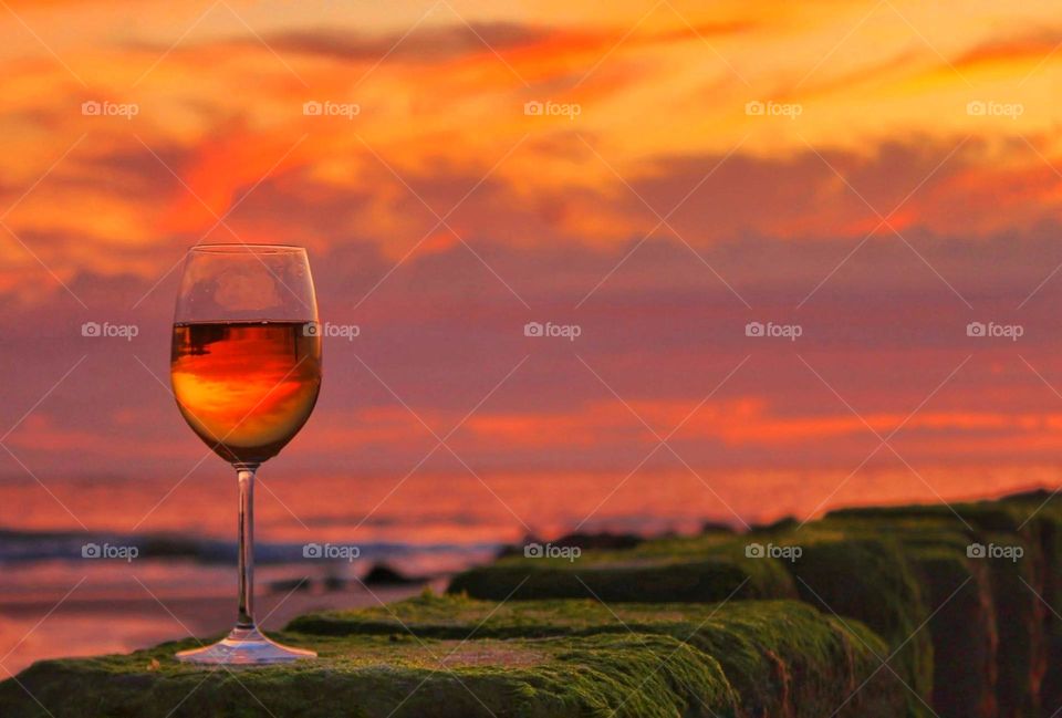 A wine glass with sunset