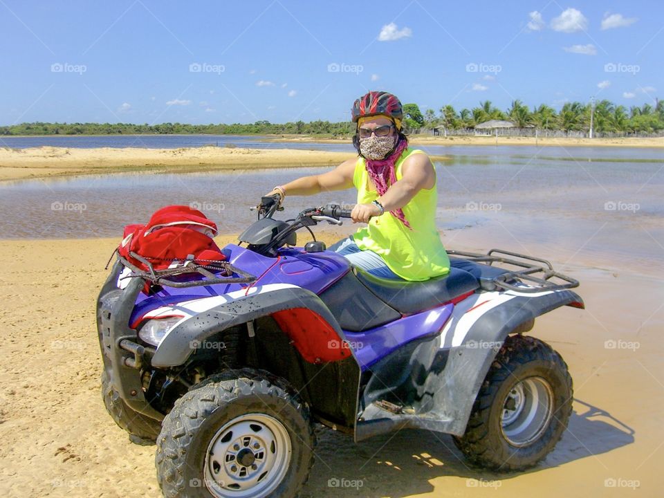 Woman driving in quad in the eco trip nature 