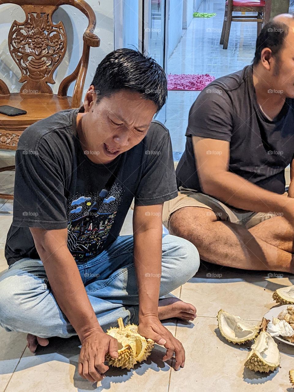 split durian to get delicious flavor. it's famous tropical fruit.