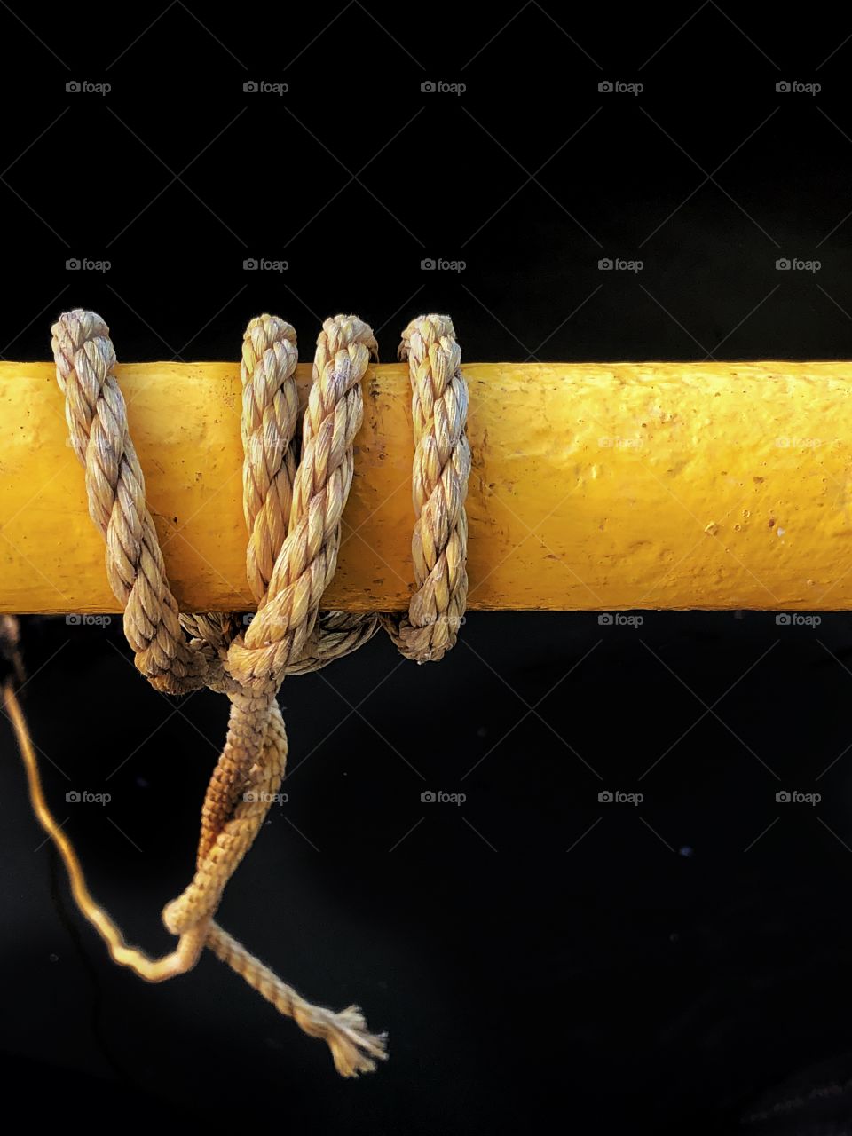 Nylon rope tied to handrail 