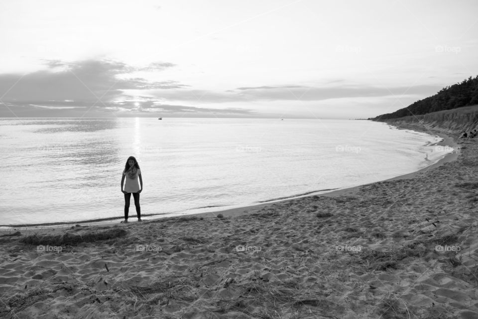 Girl on Lake Michigan . Girl on Lake Michigan at dusk. Portrait. 