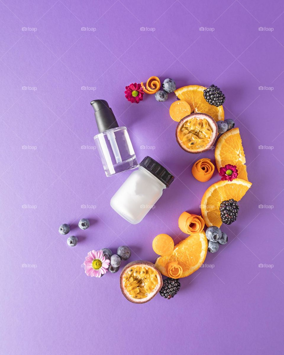 Natural cosmetic on purple background 
