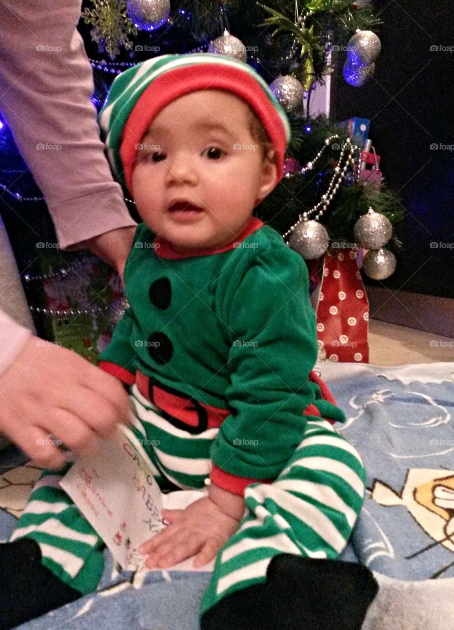 curious baby in elf clothes