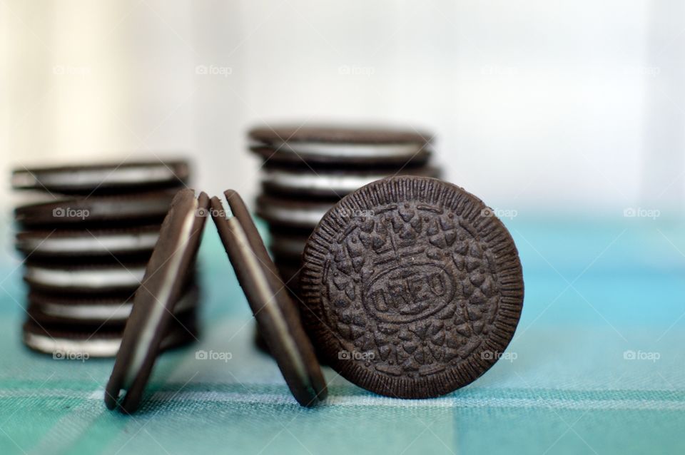 Oreo cookie thins on a white and light blue background 