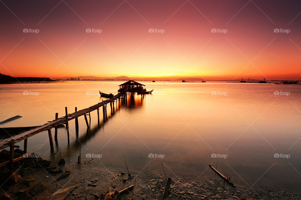 Sunrise over fisherman jetty in Penang Malaysia