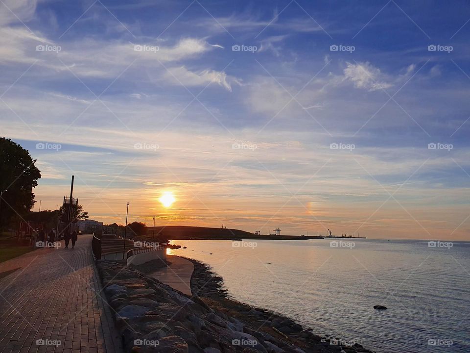 Nice evening walk by the sea during the sunset.