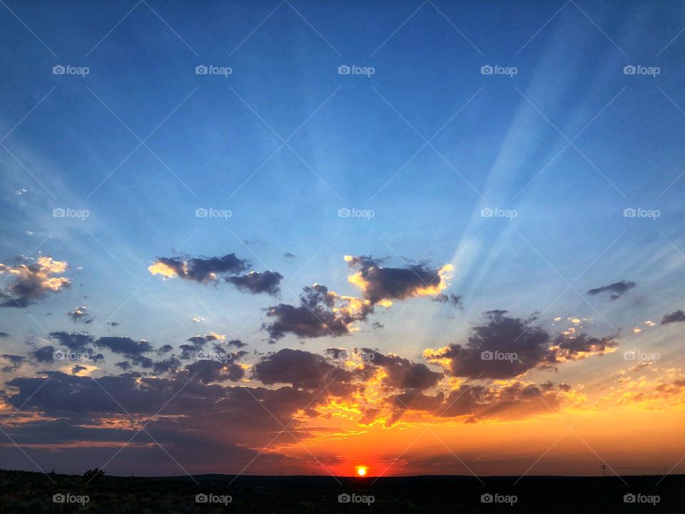 Desert sunset with clouds, beautiful mother nature as the sun sets for the evening. 