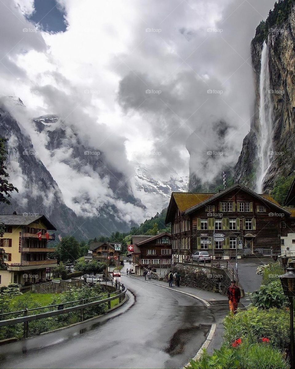 Beautiful view of a city with mountains and clouds

￼