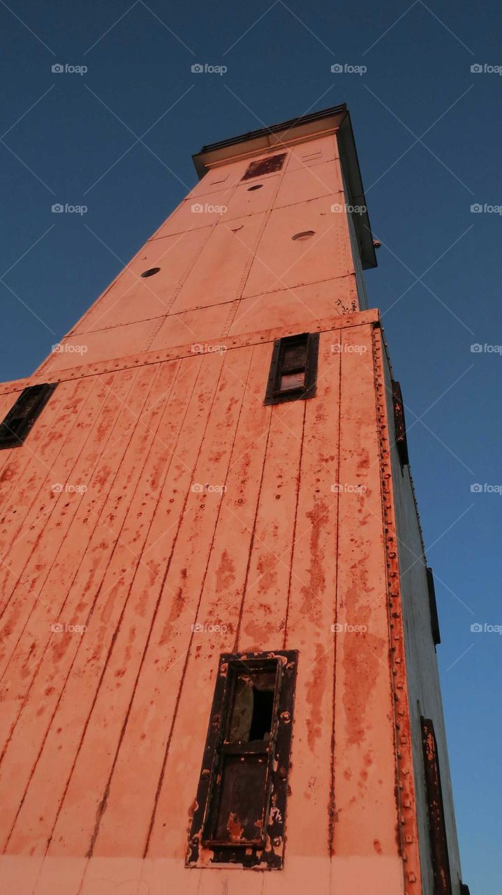 Sunset changes the color of Frankfort Harbor Pier