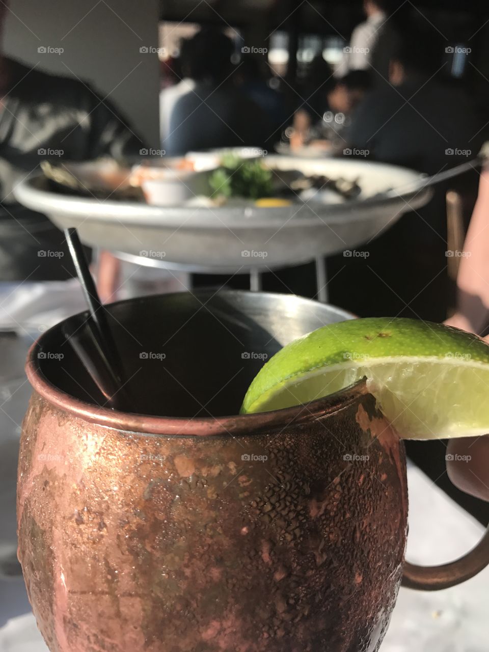 Russian mule cocktail in goblet with slice of lime