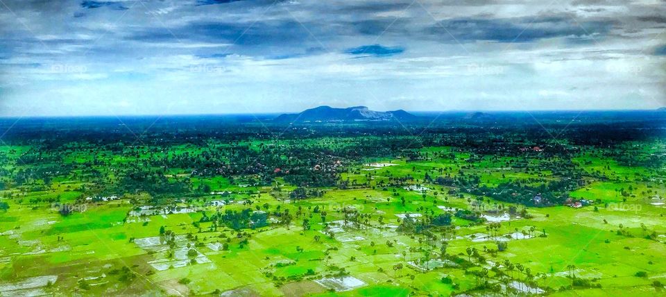 It's very beautiful field landscape in Cambodia !!! It is took from the helicopter !!!  In this pic there are many resources Such as trees, hill, and so on !!! It's very beautiful I like it so much !!! 