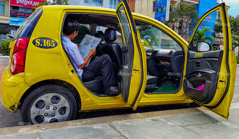 Yellow taxi. taxi driver waiting for customer in Vietnam